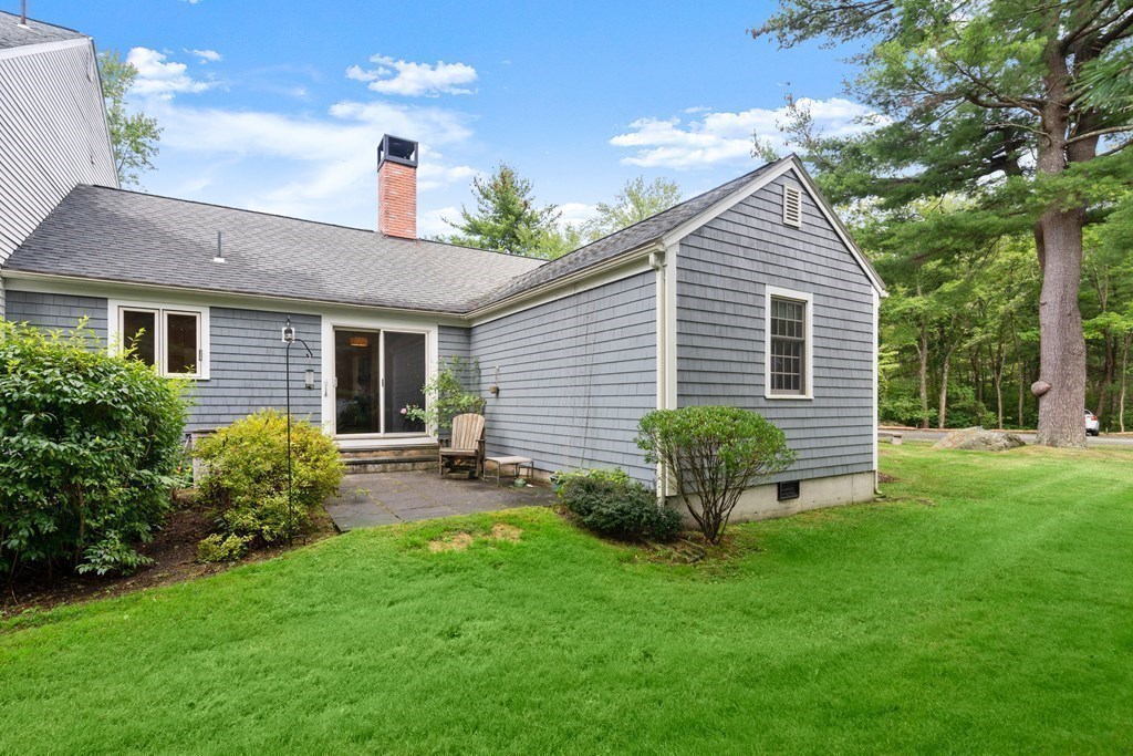 12 Jericho Road, Unit 12 Weston, MA 02493 - Photo 14 of 14 a view of a backyard with plants and a garden