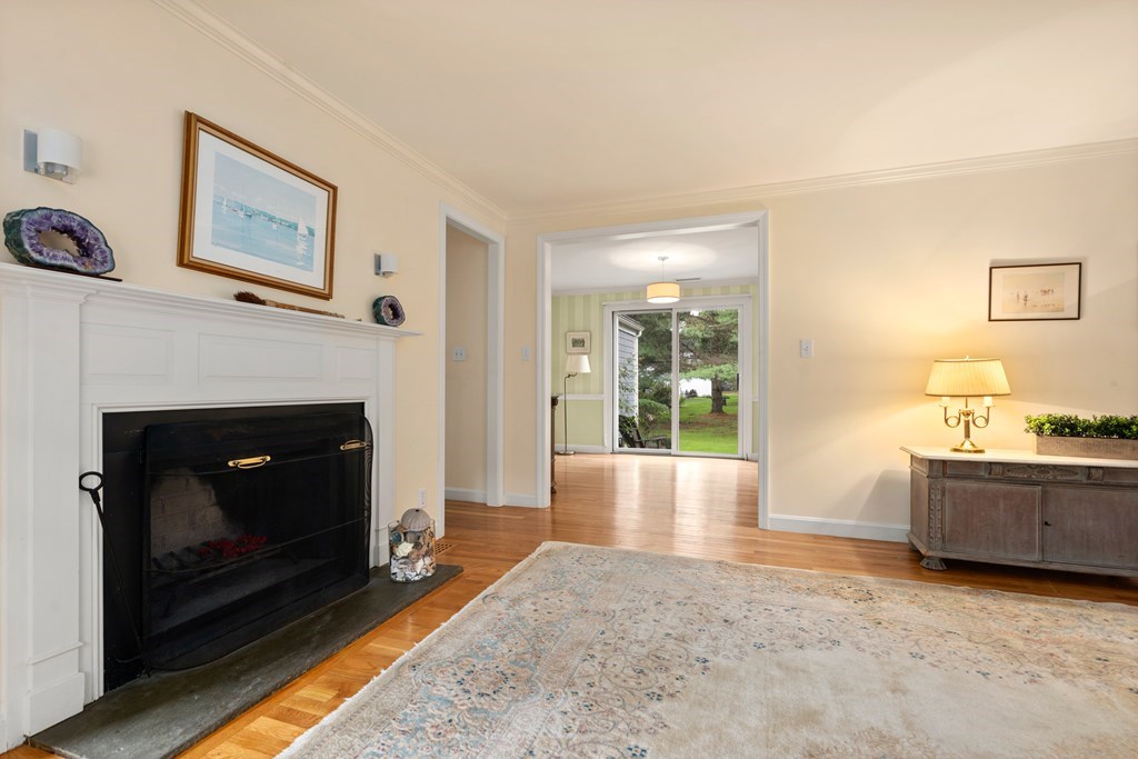 12 Jericho Road, Unit 12 Weston, MA 02493 - Photo 4 of 14 a living room with furniture and a fireplace