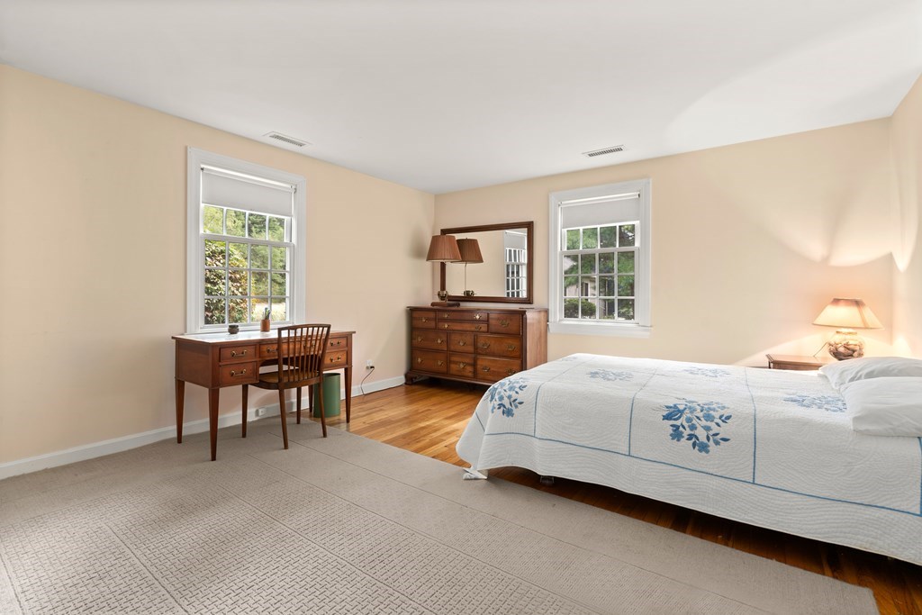 12 Jericho Road, Unit 12 Weston, MA 02493 - Photo 8 of 14 a living room with a bed furniture and a window