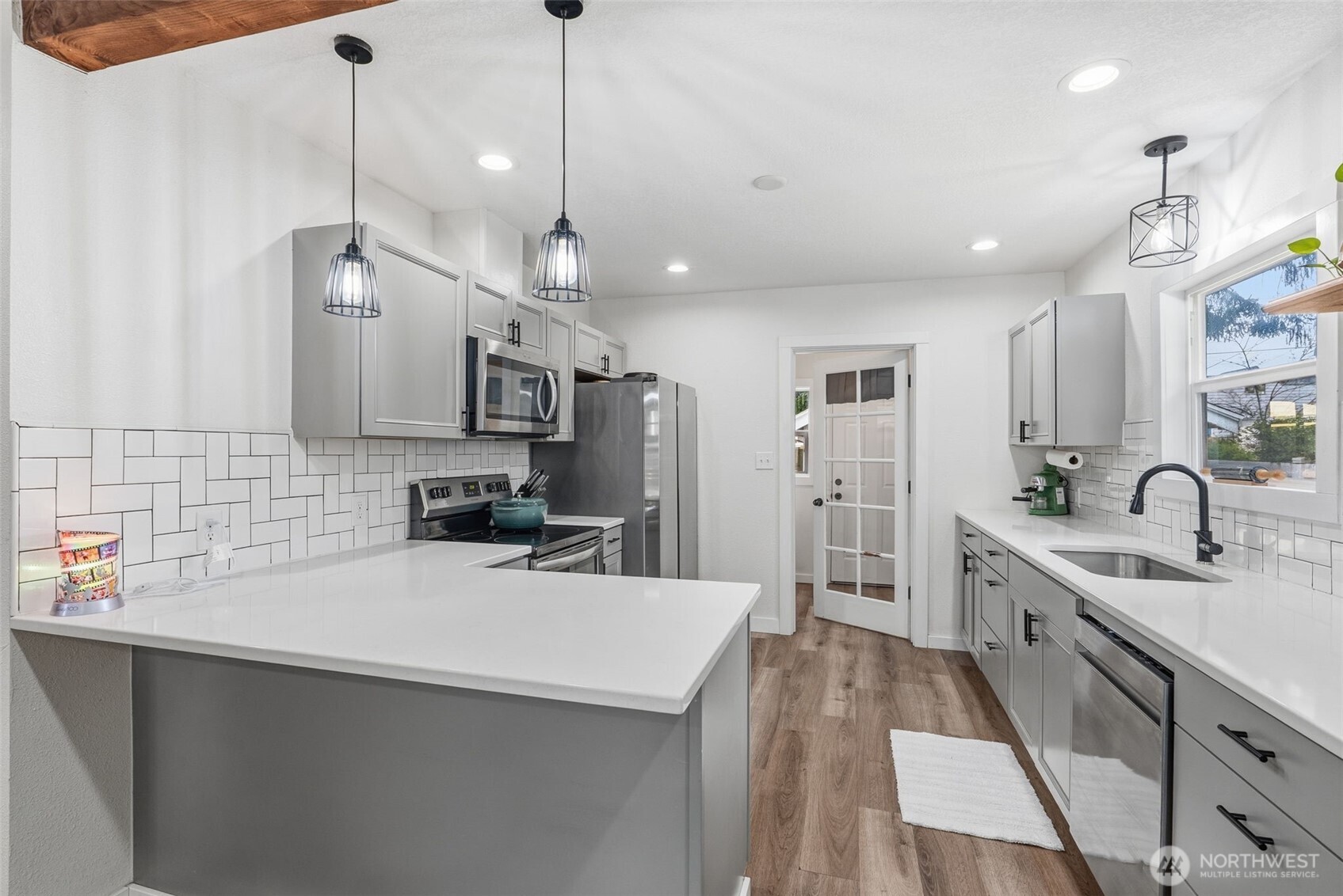 2828 Fir Street Longview, WA 98632 - Photo 6 of 18 a kitchen with kitchen island a sink stainless steel appliances and window