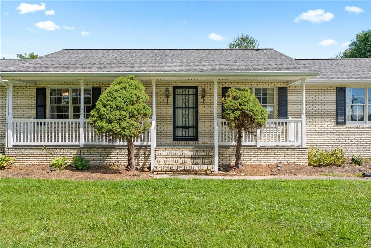 1250 Mt Torrey Road Lyndhurst, VA 22952 - Photo 4 of 35 a front view of a house with a garden and plants