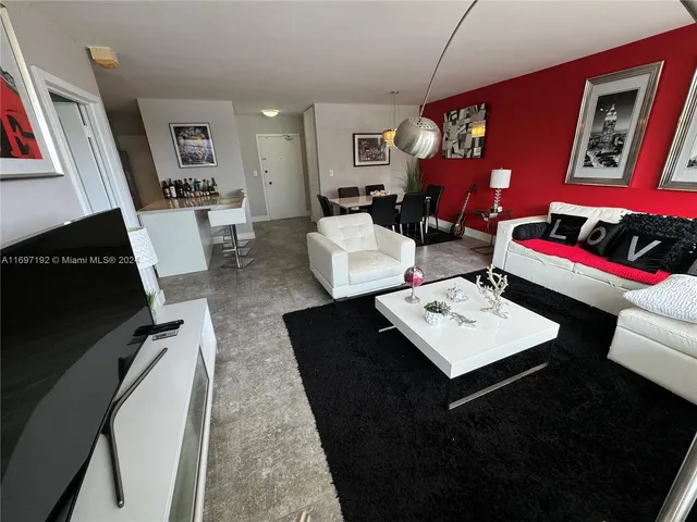 a living room with furniture and a rug