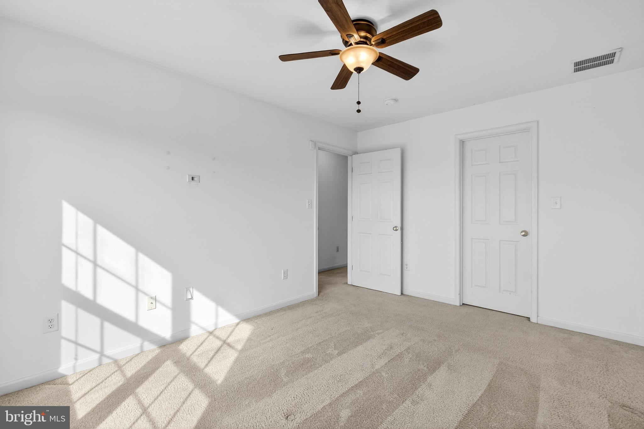 24 Springfield Circle Middletown, DE 19709 - Photo 34 of 72 a view of a big room with wooden floor and a chandelier fan