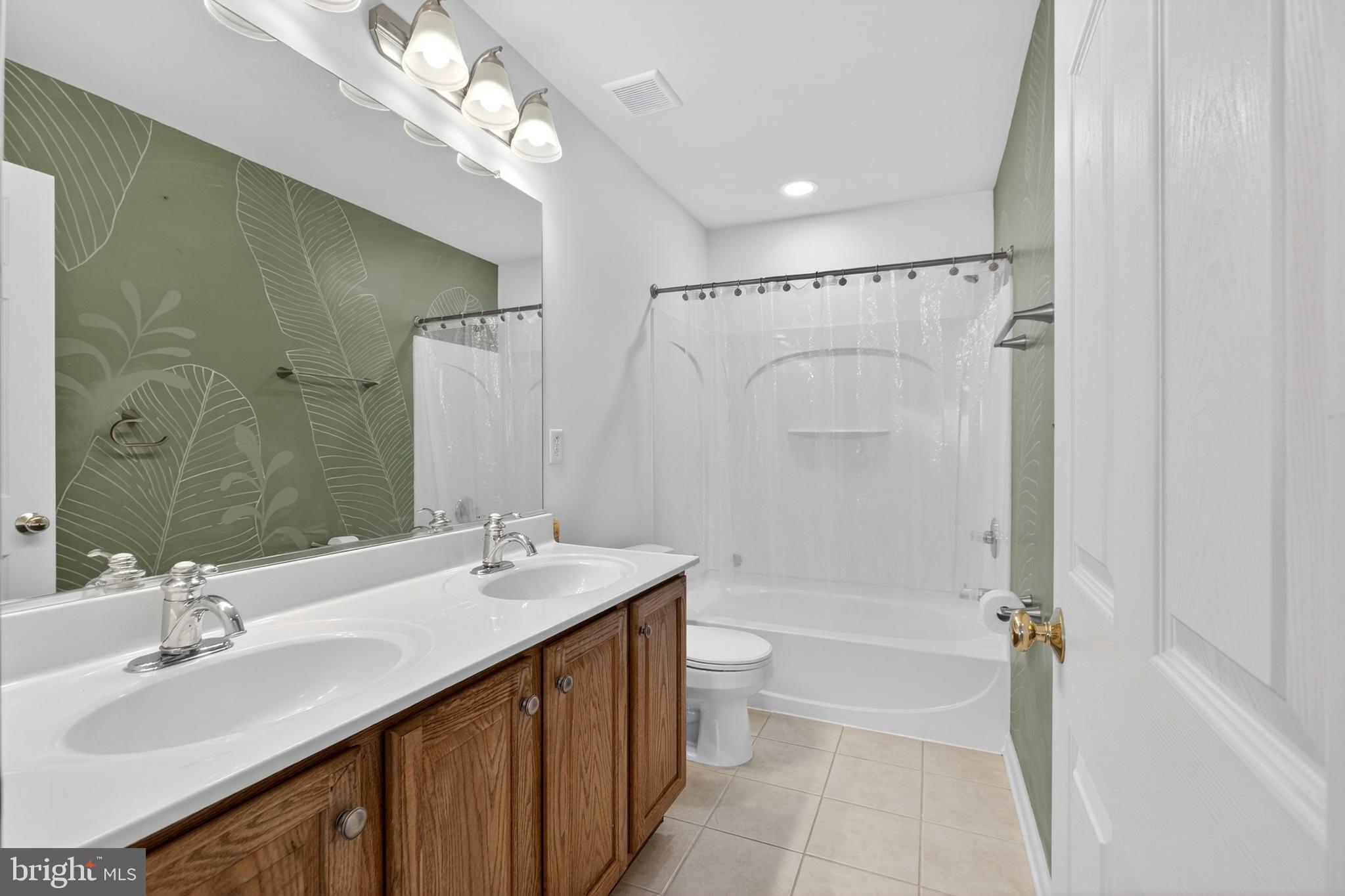 24 Springfield Circle Middletown, DE 19709 - Photo 35 of 72 a bathroom with a sink a toilet a mirror and shower