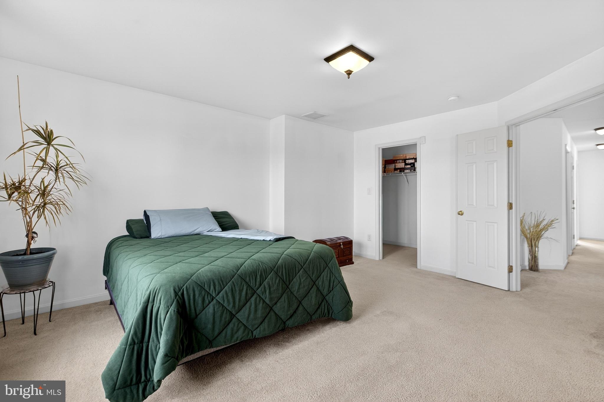 24 Springfield Circle Middletown, DE 19709 - Photo 39 of 72 a spacious bedroom with a bed and a table