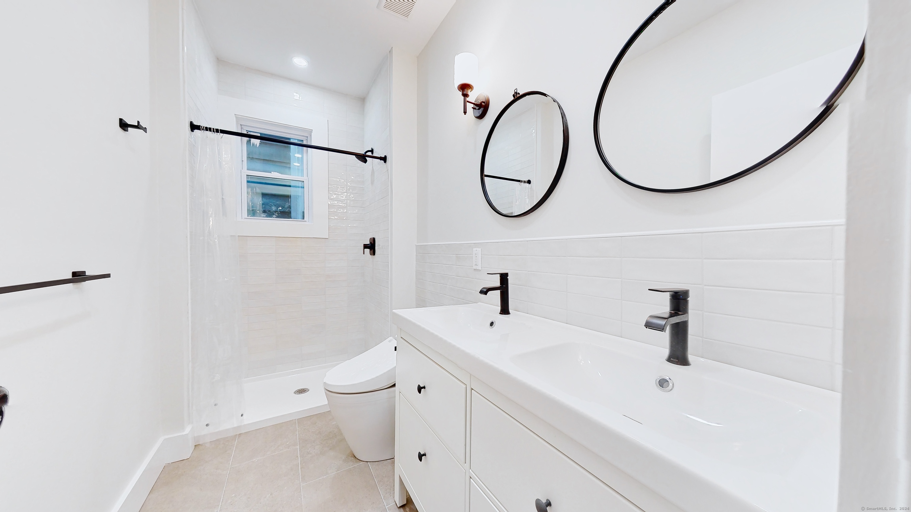 86 Edwards Street, Unit 1 New Haven, CT 06511 - Photo 12 of 40 a bathroom with a sink a toilet and a mirror