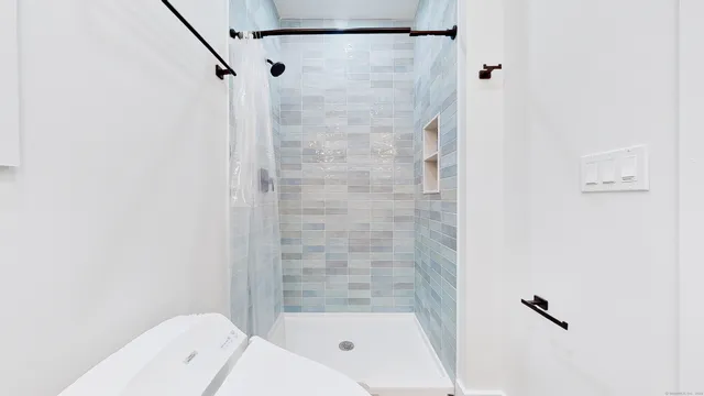 a bathroom with a bathtub and shower