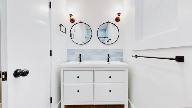 a bathroom with a sink and a mirror