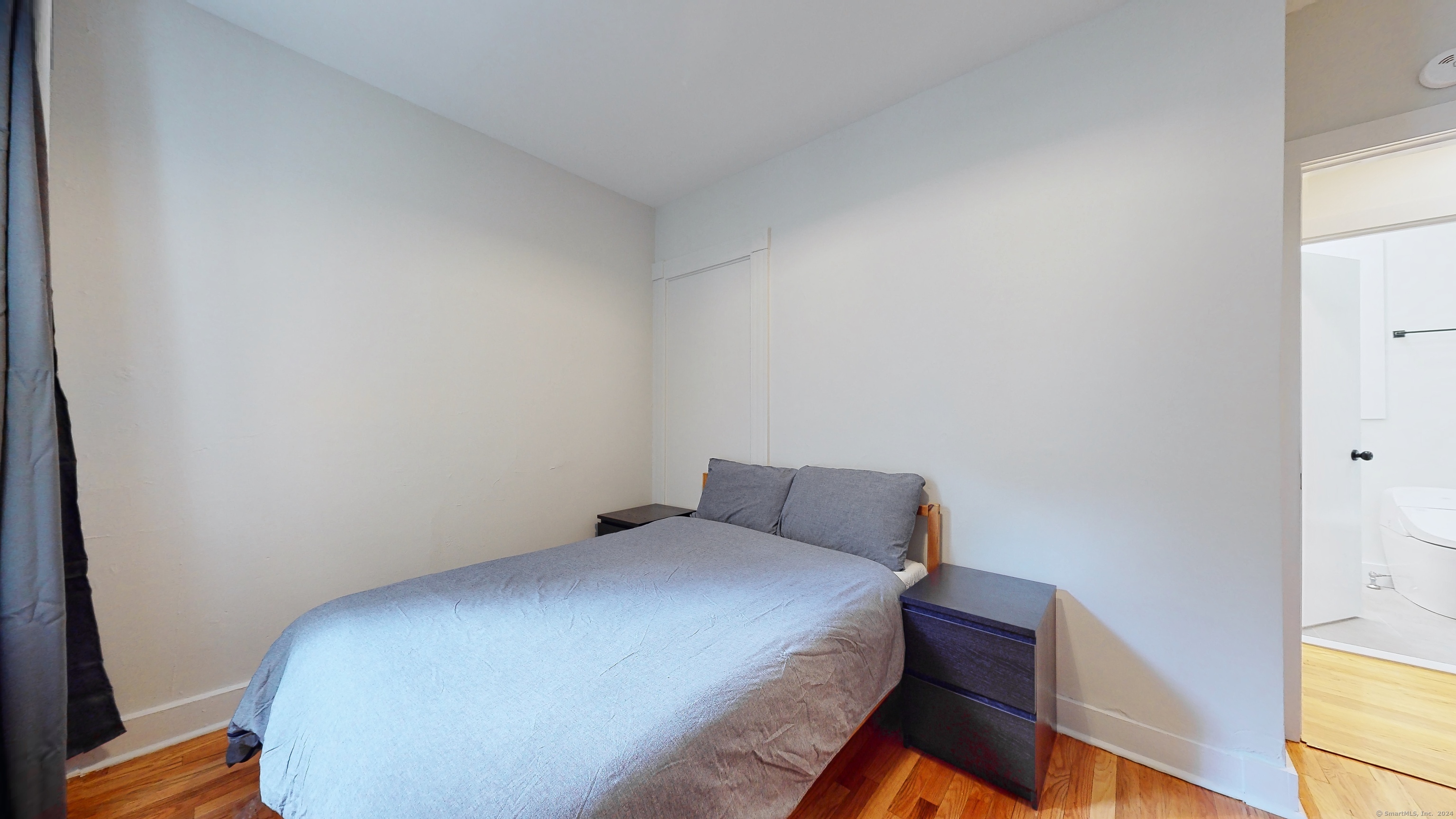 86 Edwards Street, Unit 1 New Haven, CT 06511 - Photo 20 of 40 a bedroom with a bed and wooden floor