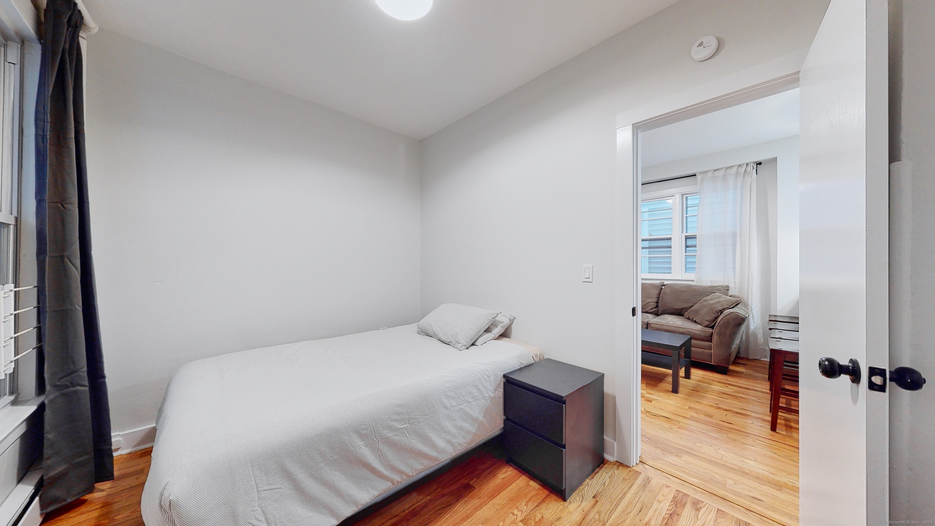 86 Edwards Street, Unit 1 New Haven, CT 06511 - Photo 26 of 40 a bedroom with a bed and wooden floor