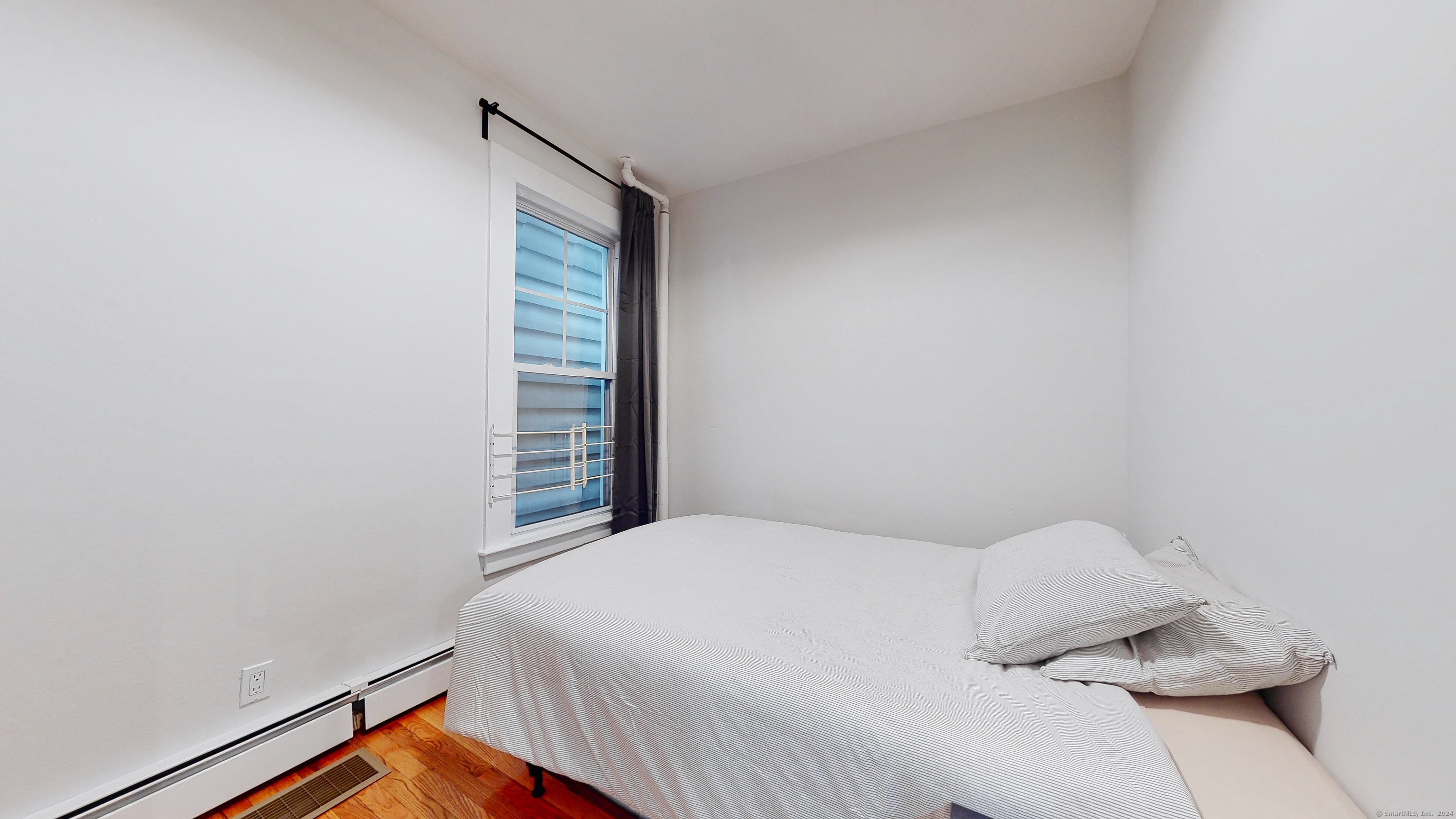 86 Edwards Street, Unit 1 New Haven, CT 06511 - Photo 27 of 40 a bedroom with a bed and a window