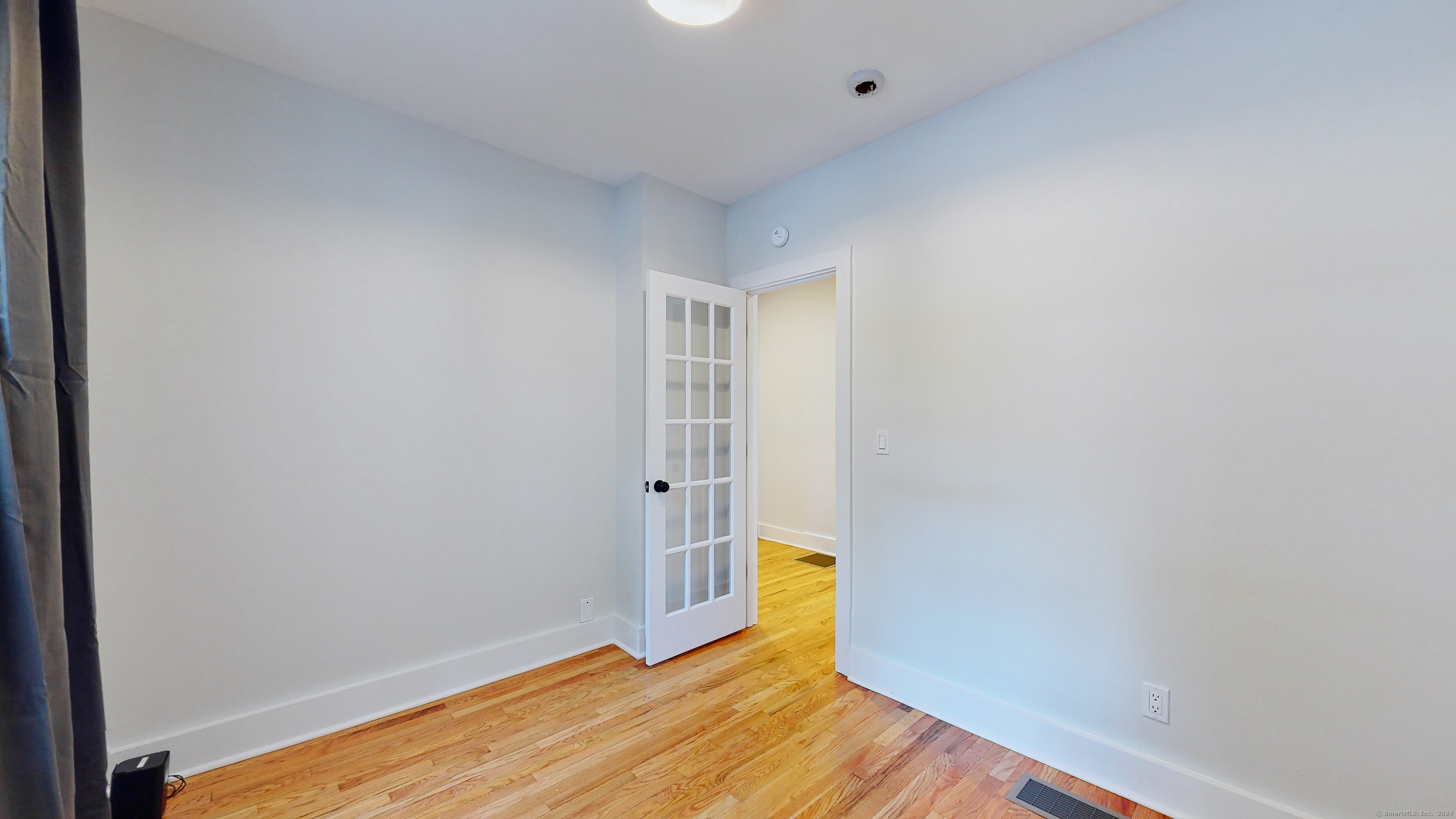 86 Edwards Street, Unit 1 New Haven, CT 06511 - Photo 29 of 40 a view of a room with wooden floor and fence