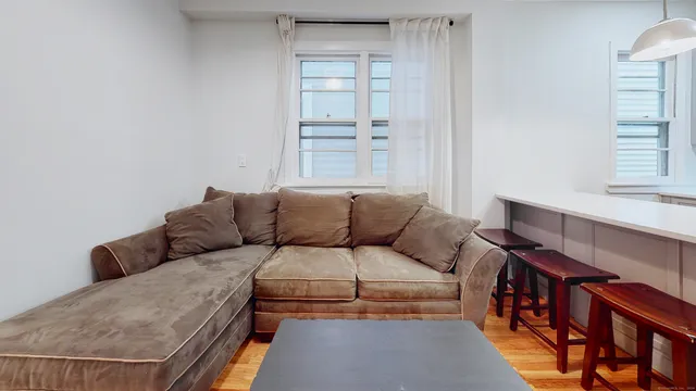 a living room with furniture and a window