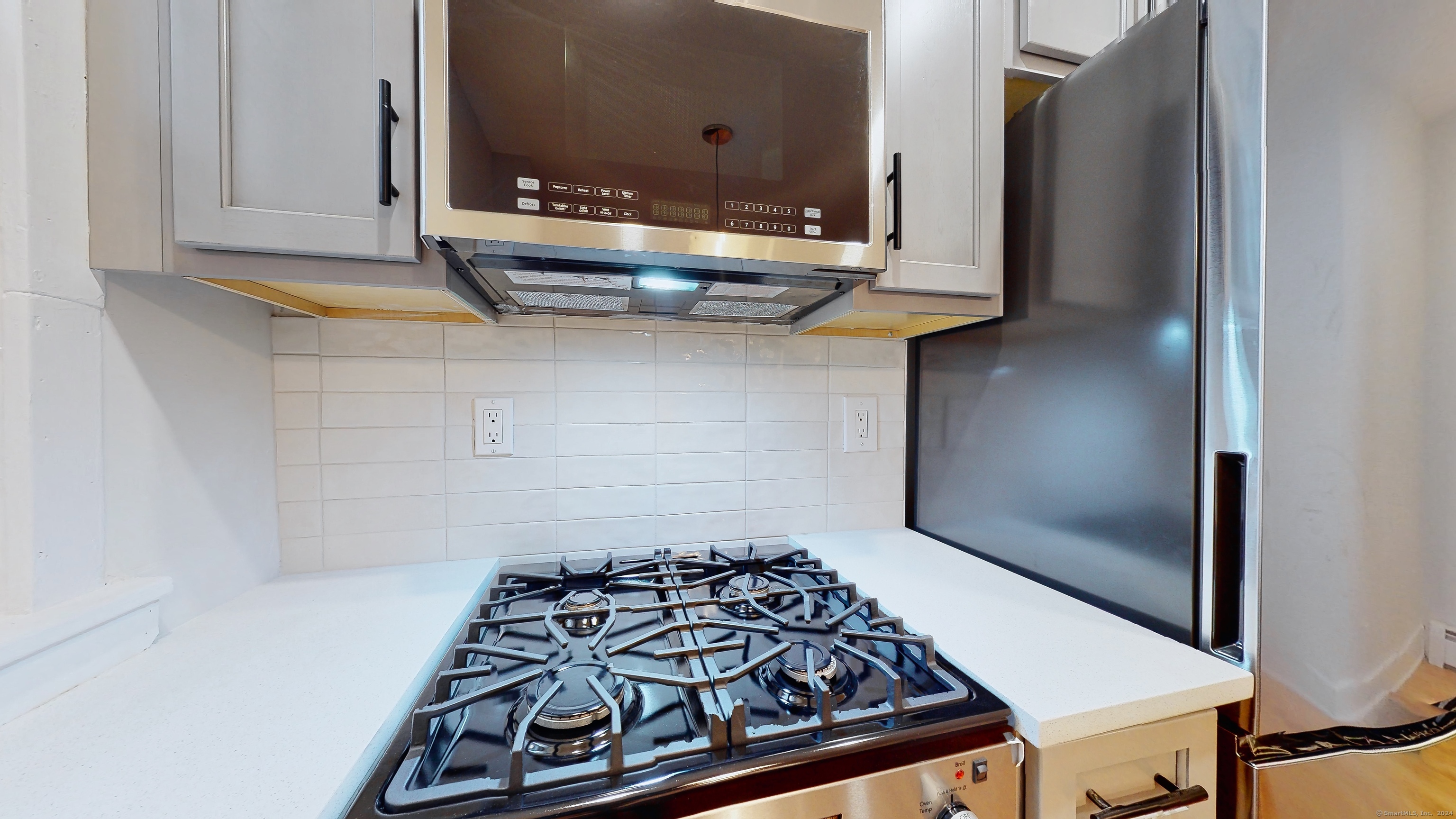 86 Edwards Street, Unit 1 New Haven, CT 06511 - Photo 32 of 40 a kitchen with a stove and a refrigerator
