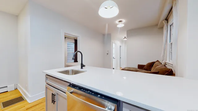 a bedroom with a bed and a sink