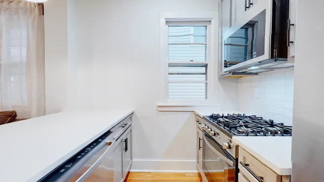 a kitchen with a stove and a microwave
