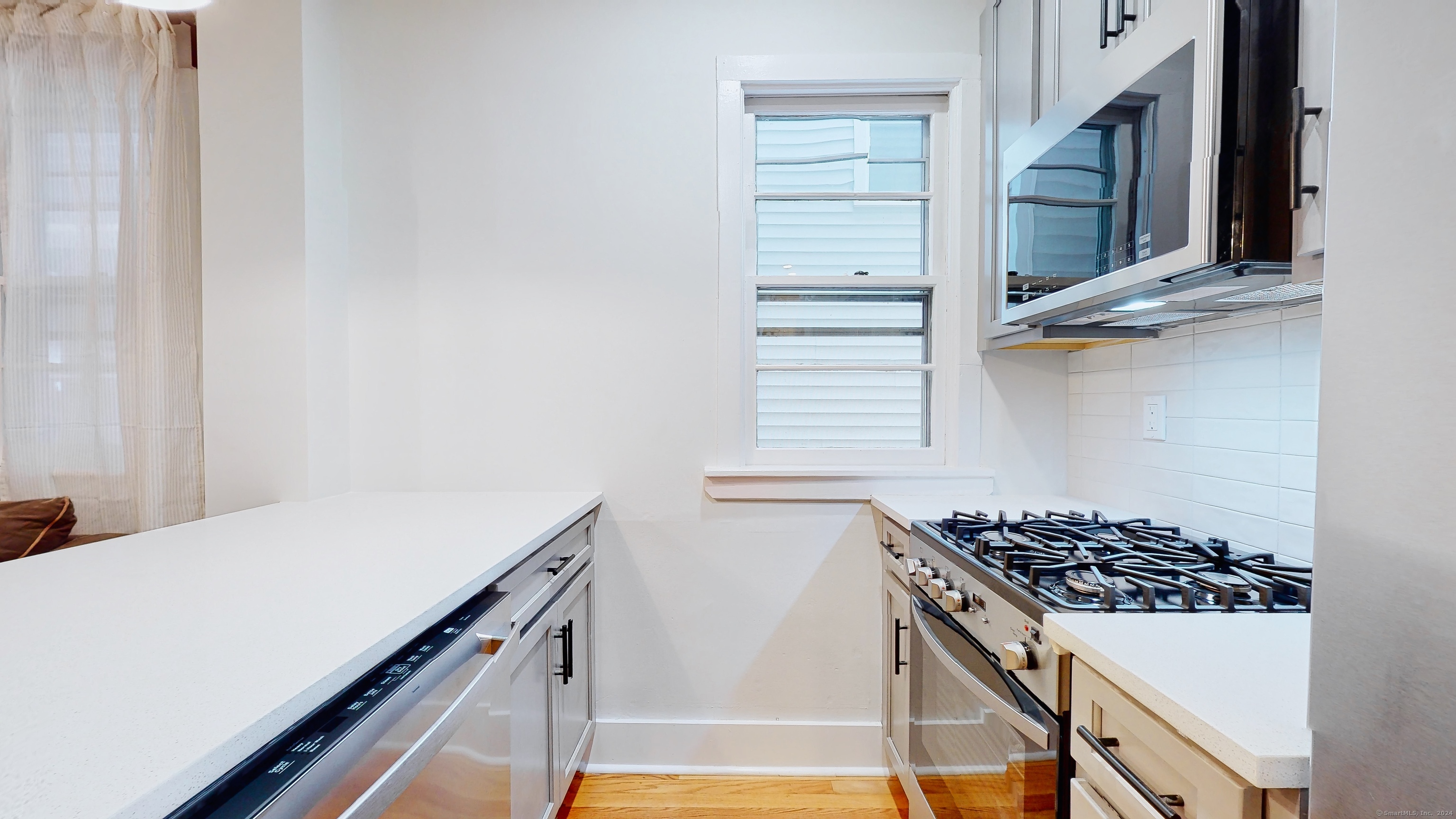 86 Edwards Street, Unit 1 New Haven, CT 06511 - Photo 34 of 40 a kitchen with a stove and a microwave