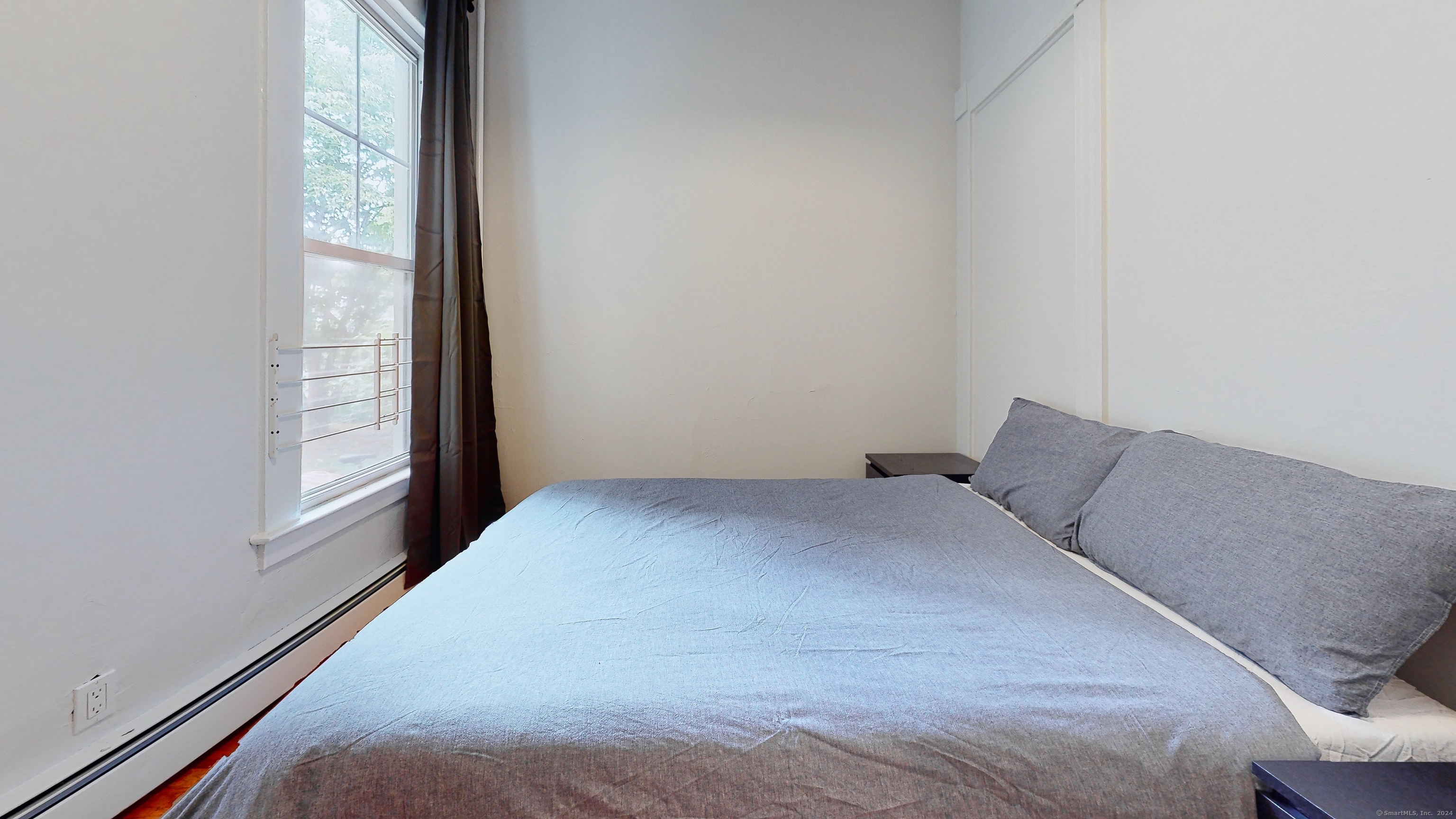 86 Edwards Street, Unit 1 New Haven, CT 06511 - Photo 7 of 40 a bedroom with a bed and a window