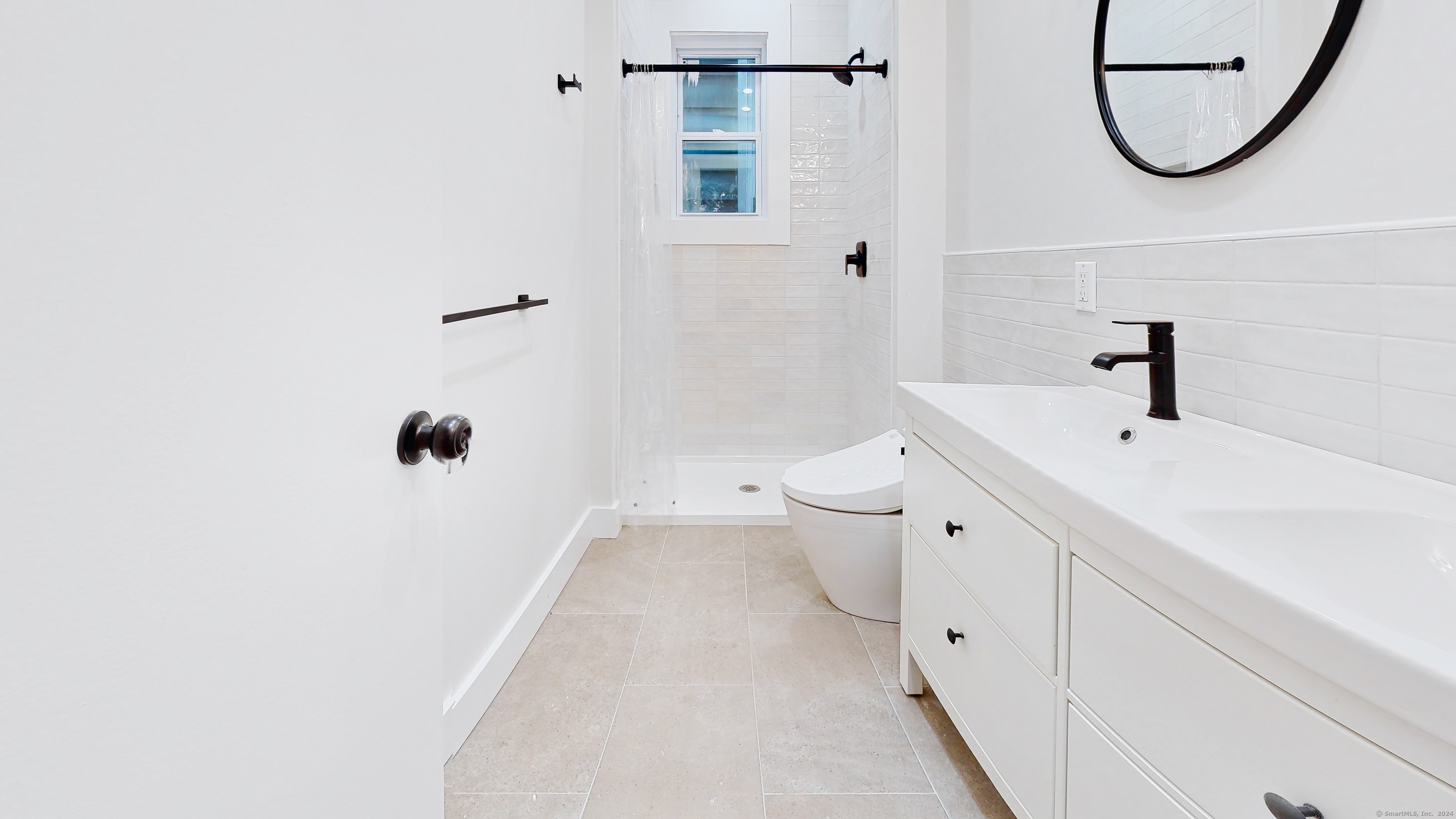 86 Edwards Street, Unit 1 New Haven, CT 06511 - Photo 10 of 40 a bathroom with a sink and a mirror