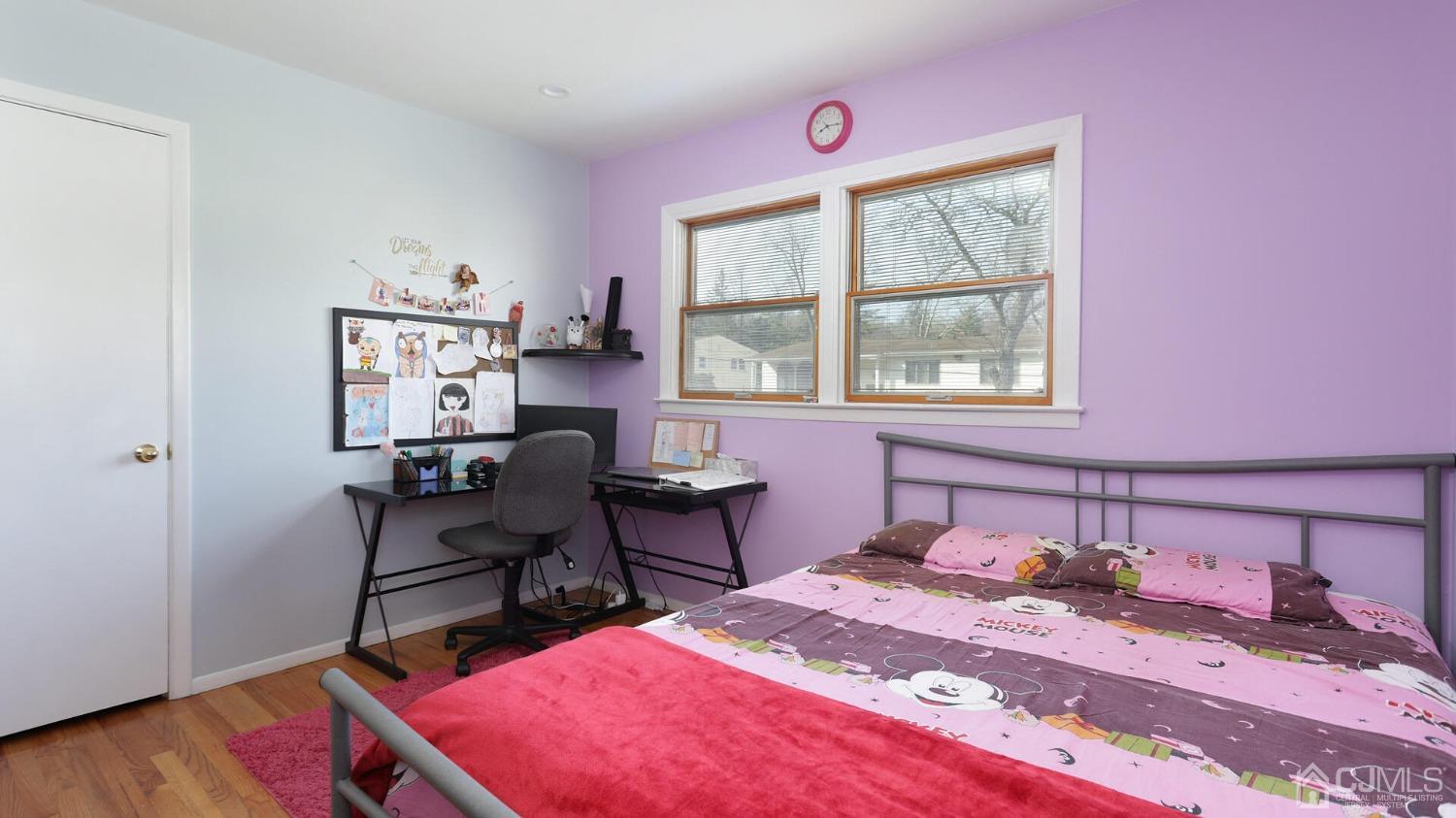 20 Peake Road Edison, NJ 08837 - Photo 19 of 34 a bedroom with a bed a desk and chair with wooden floor