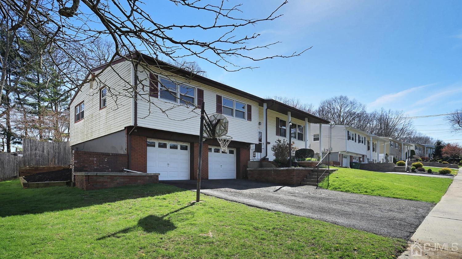 20 Peake Road Edison, NJ 08837 - Photo 2 of 34 a front view of a house with a yard