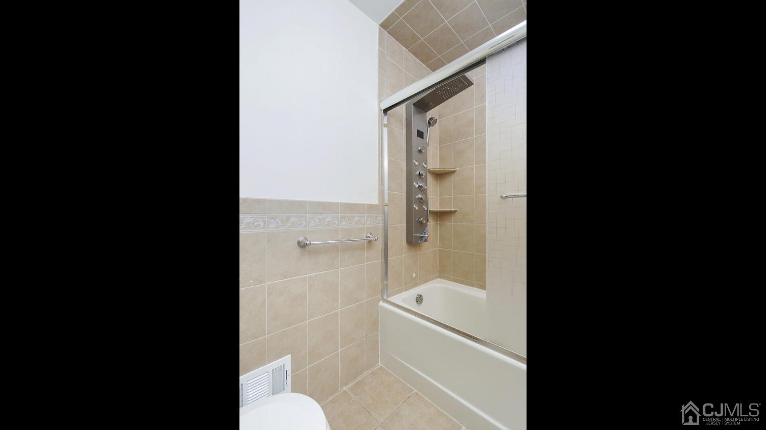 20 Peake Road Edison, NJ 08837 - Photo 23 of 34 a bathroom with a toilet and a shower