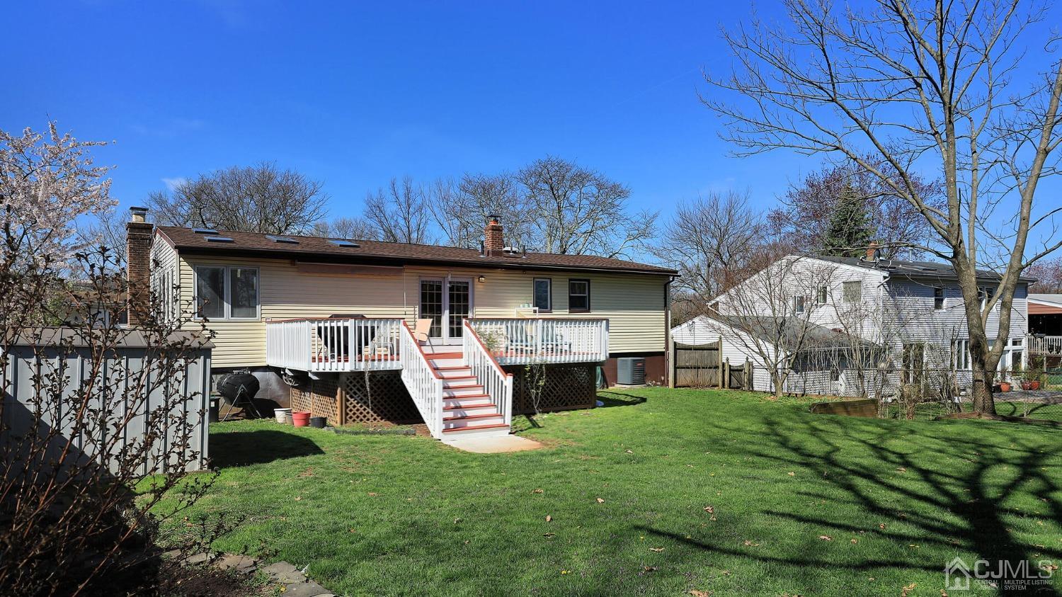 20 Peake Road Edison, NJ 08837 - Photo 30 of 34 a front view of house with yard barbeque and outdoor seating