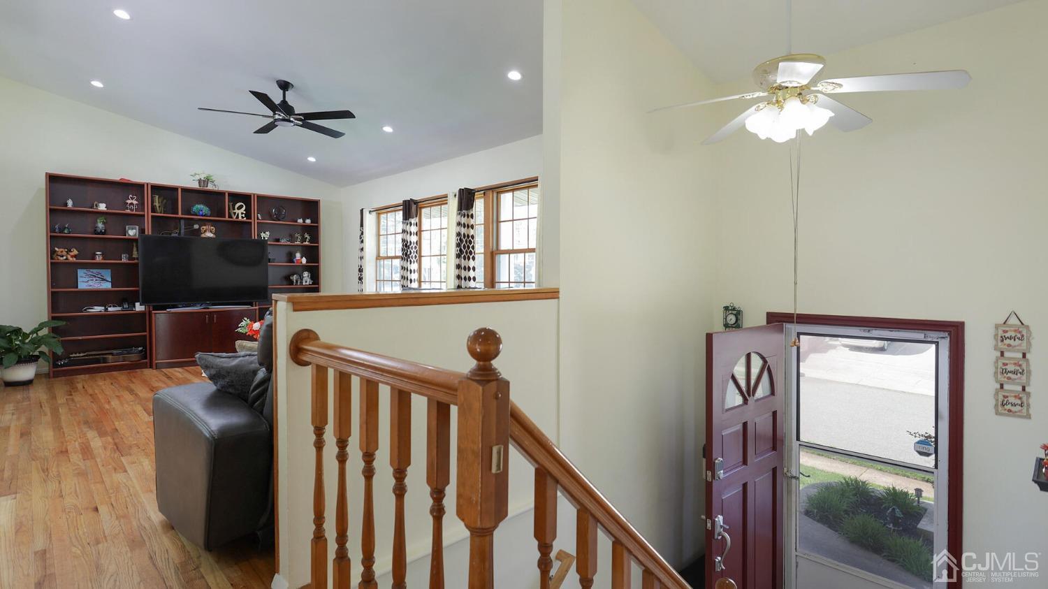 20 Peake Road Edison, NJ 08837 - Photo 5 of 34 a view of a livingroom with furniture a ceiling fan and wooden floor