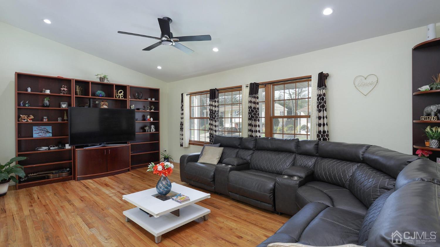 20 Peake Road Edison, NJ 08837 - Photo 6 of 34 a living room with furniture and a flat screen tv
