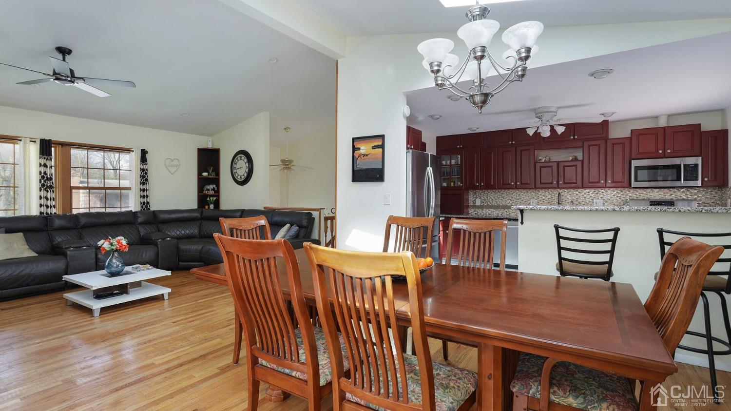 20 Peake Road Edison, NJ 08837 - Photo 8 of 34 a view of a dining room with furniture a chandelier and wooden floor