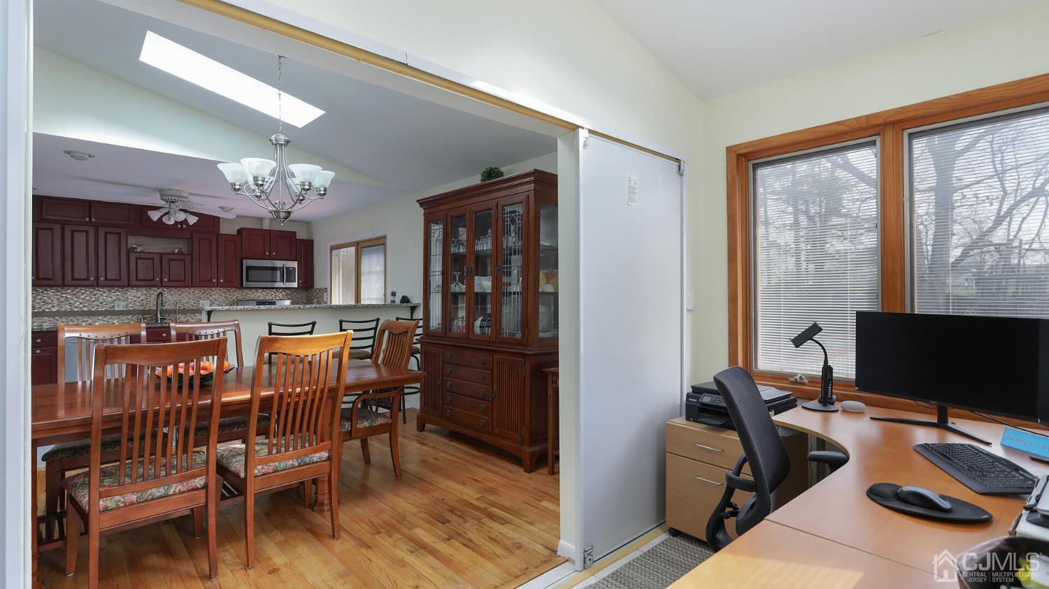 20 Peake Road Edison, NJ 08837 - Photo 10 of 34 a dining room with furniture a chandelier and wooden floor
