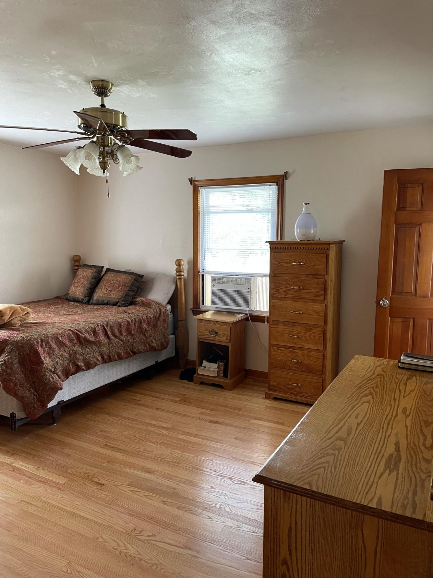 1135 Oddfellows Road Vinton, VA 24179 - Photo 11 of 34 a bedroom with a bed and a chandelier