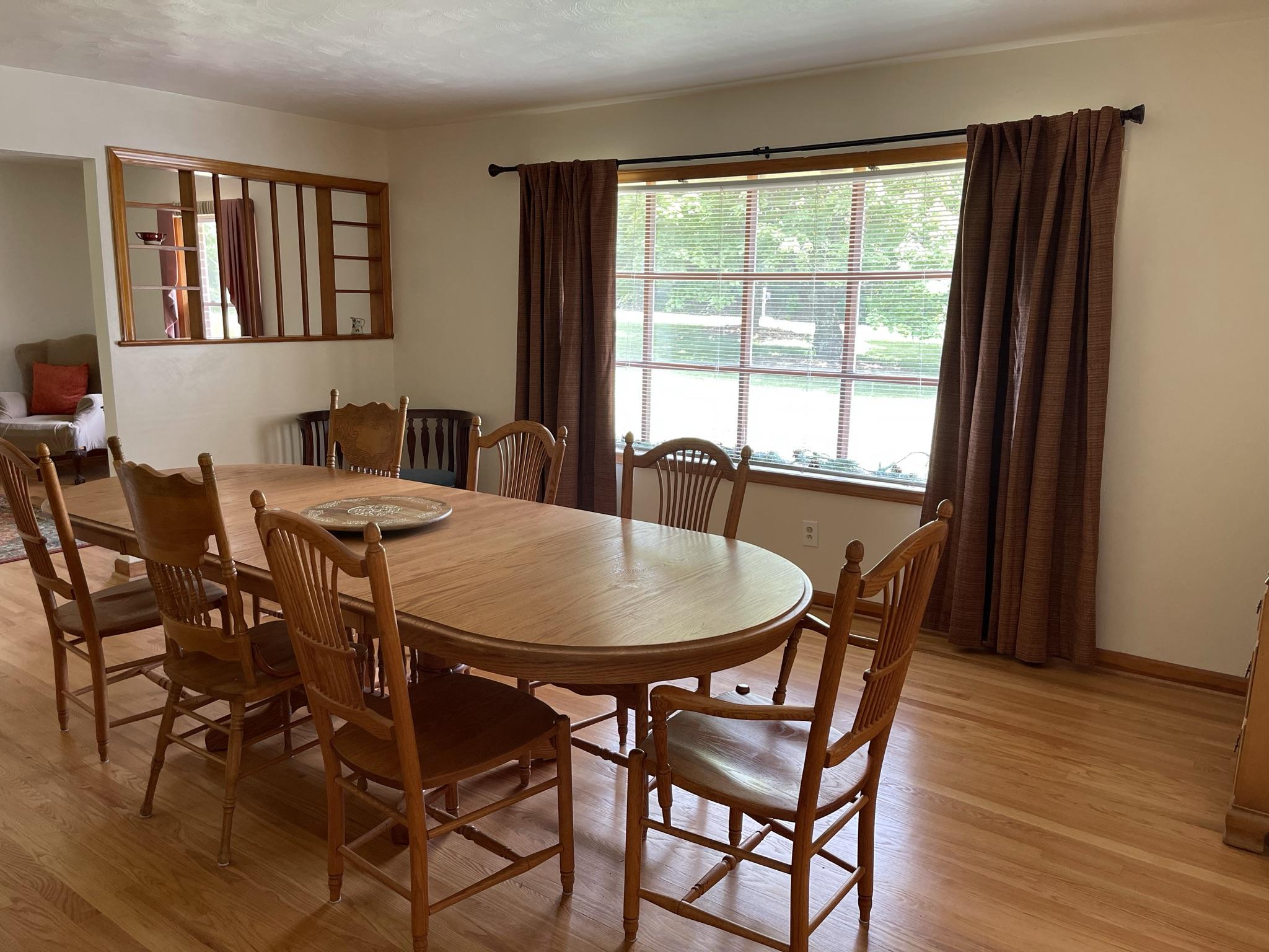 1135 Oddfellows Road Vinton, VA 24179 - Photo 3 of 34 a view of a dining room with furniture and wooden floor