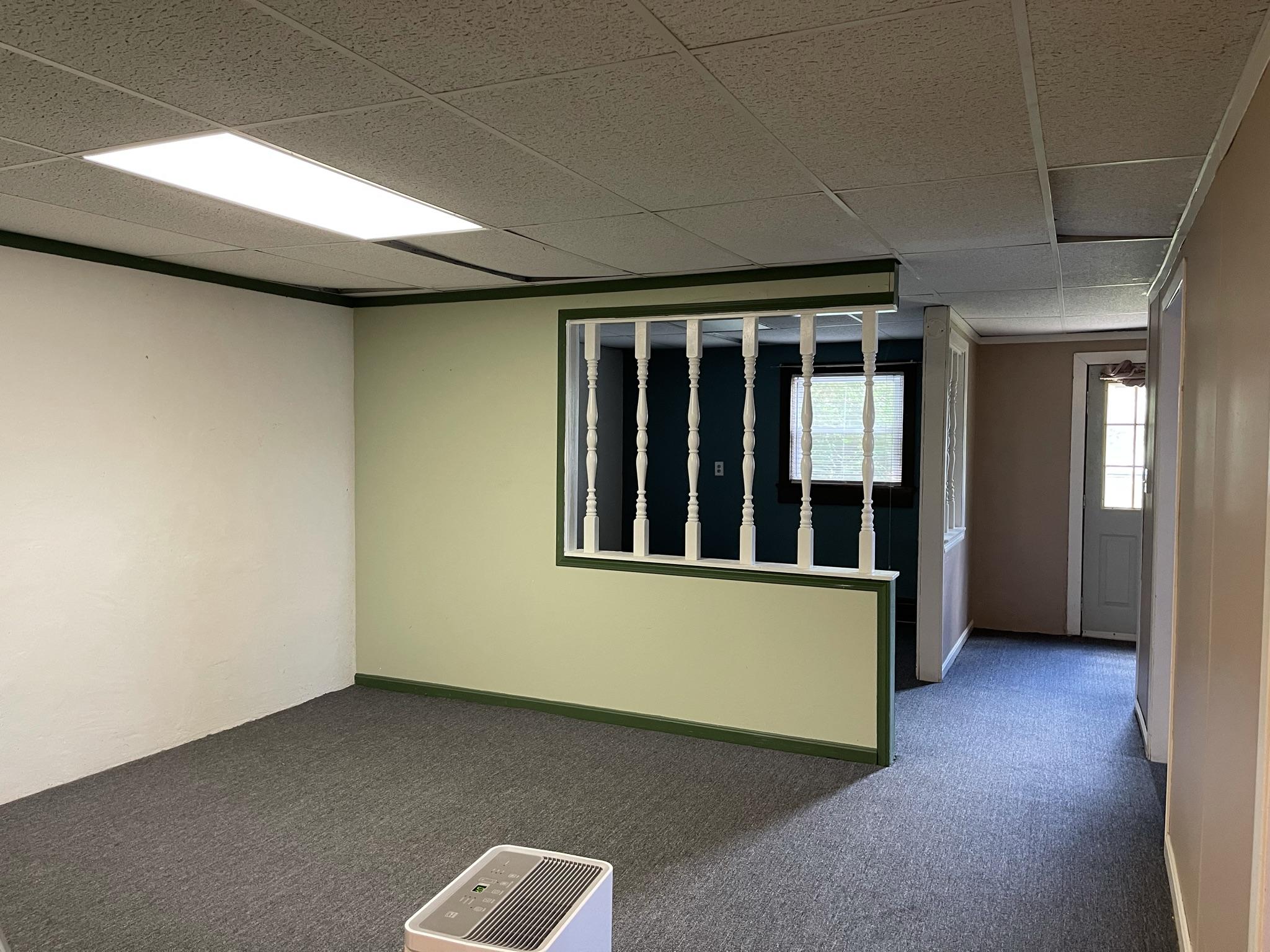 1135 Oddfellows Road Vinton, VA 24179 - Photo 21 of 34 an empty room with wooden floor and windows