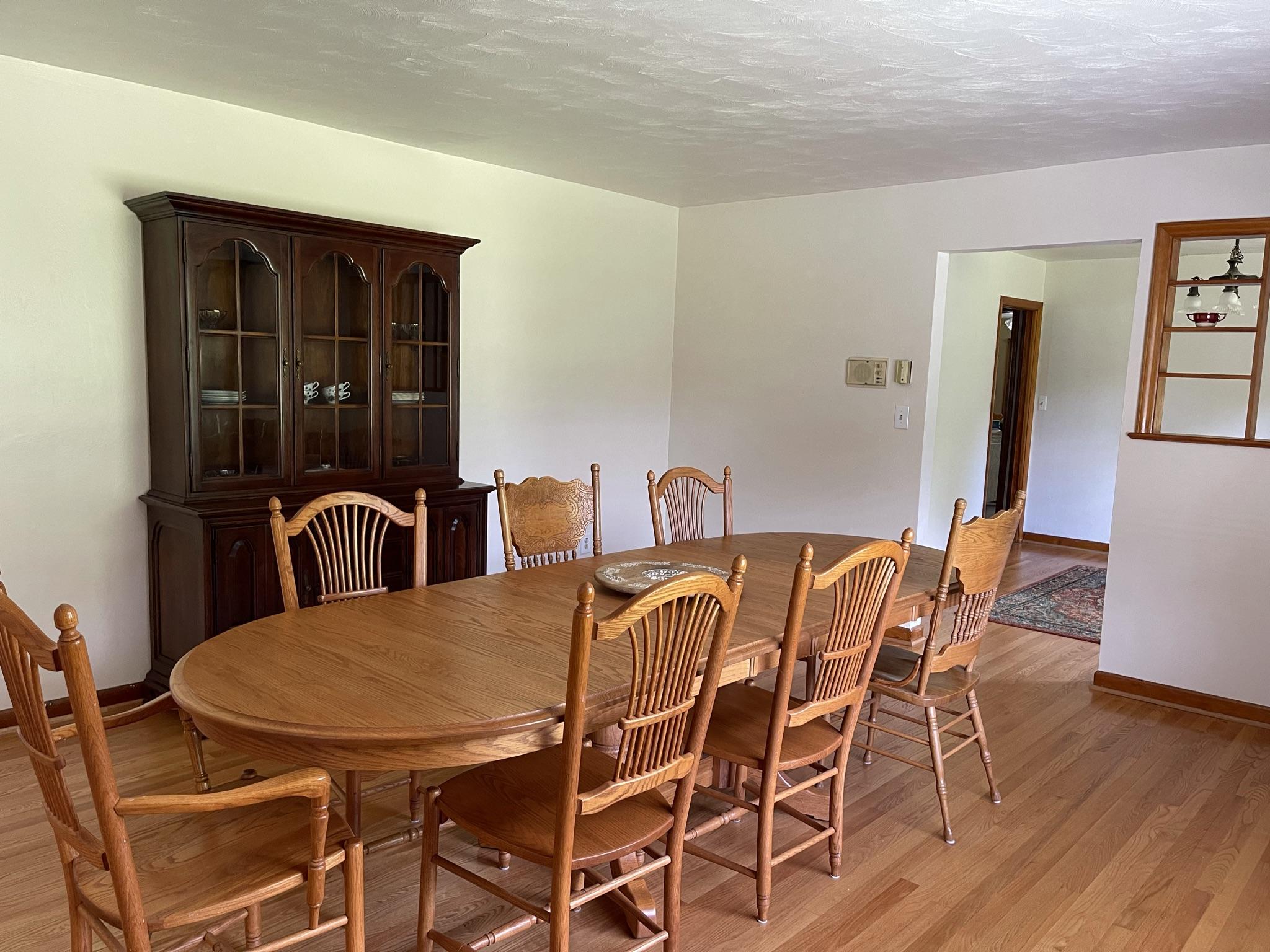 1135 Oddfellows Road Vinton, VA 24179 - Photo 4 of 34 a view of a dining room with furniture and wooden floor