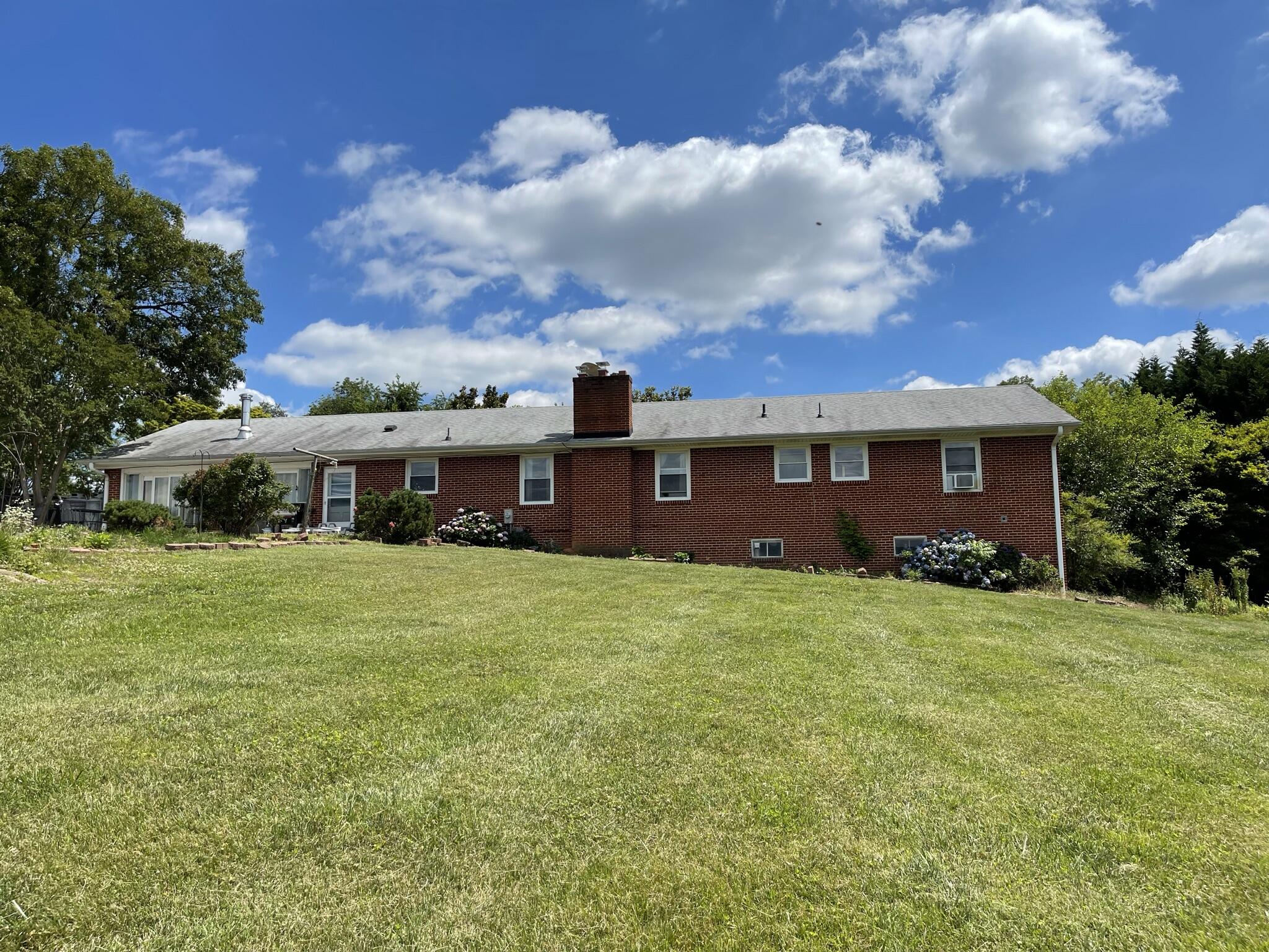1135 Oddfellows Road Vinton, VA 24179 - Photo 32 of 34 a front view of a house with a garden