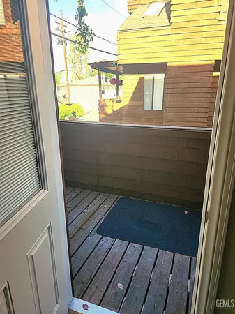 a view of a balcony with wooden floor