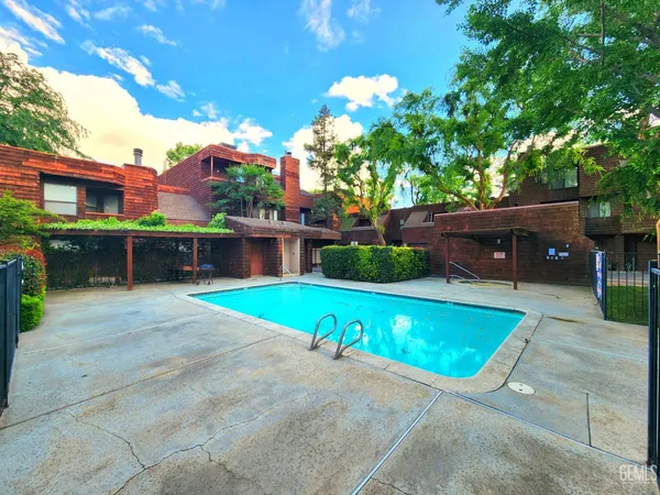 a view of a swimming pool with a patio