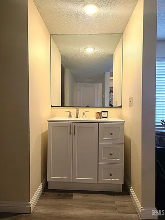 a bathroom with a mirror and a sink