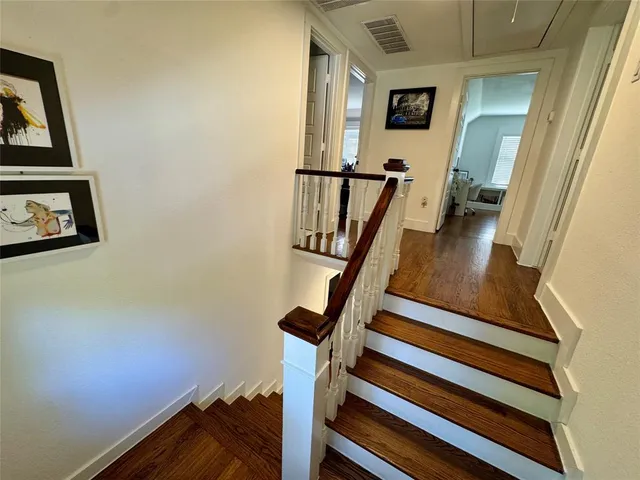 a view of front door with wooden floor