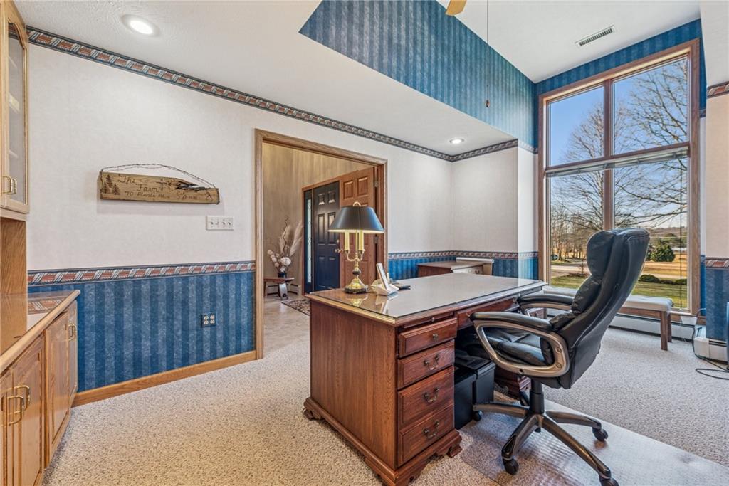 404 Oneida Trail Mercer, PA 16137 - Photo 12 of 50 The large office includes built-ins with shelving & cabinets & built-in wall speakers, along with a beautiful bay window, overlooking the LLPOA common area with a lakeview.