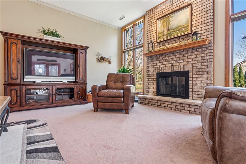 404 Oneida Trail Mercer, PA 16137 - Photo 14 of 50 The living room has floor to ceiling windows, 10 ft ceilings and a woodburning or gas fireplace.