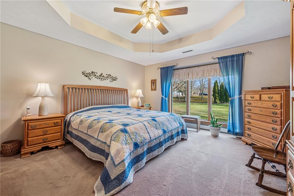 404 Oneida Trail Mercer, PA 16137 - Photo 16 of 50 The first floor primary bedroom with en suite, large walk-in closet & beautiful bay windows.