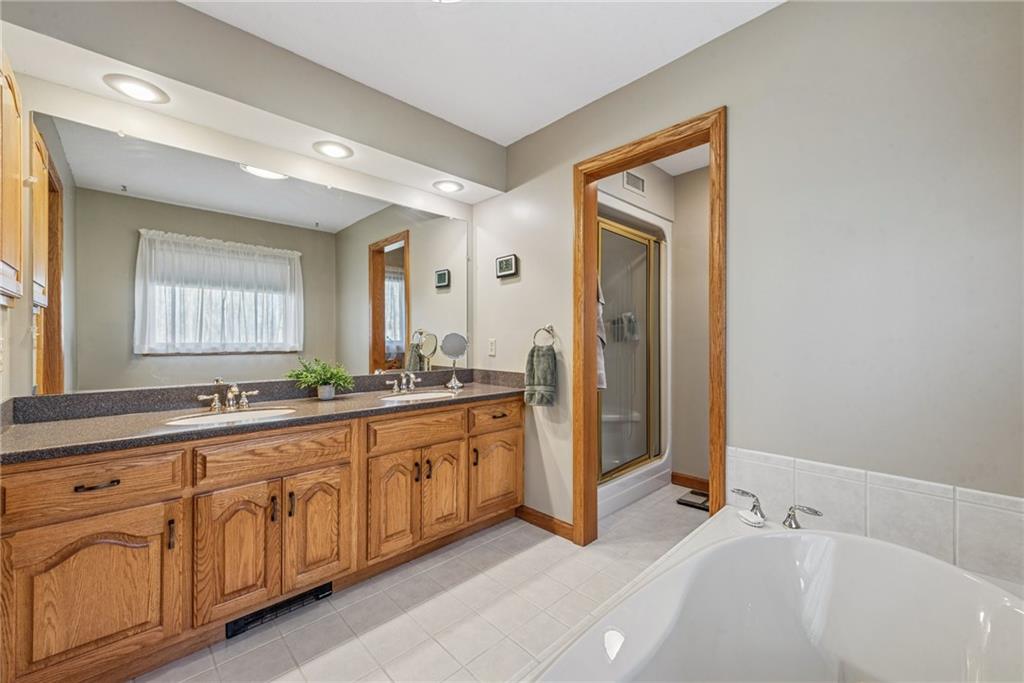 404 Oneida Trail Mercer, PA 16137 - Photo 19 of 50 Large primary en suite with double sink and a large tub.
