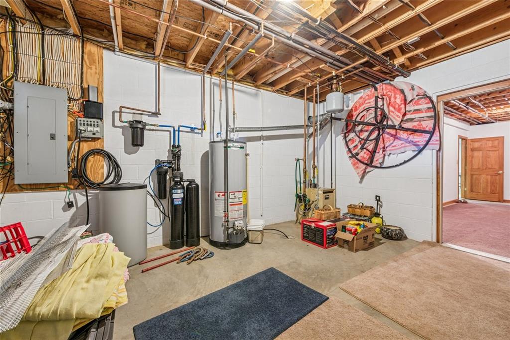 404 Oneida Trail Mercer, PA 16137 - Photo 33 of 50 Additional garage large, complete with a sink & enough space for all the lawn equipment, golf carts, tools or anything else you may need to store. Ash cleanout for first floor fireplace as well.