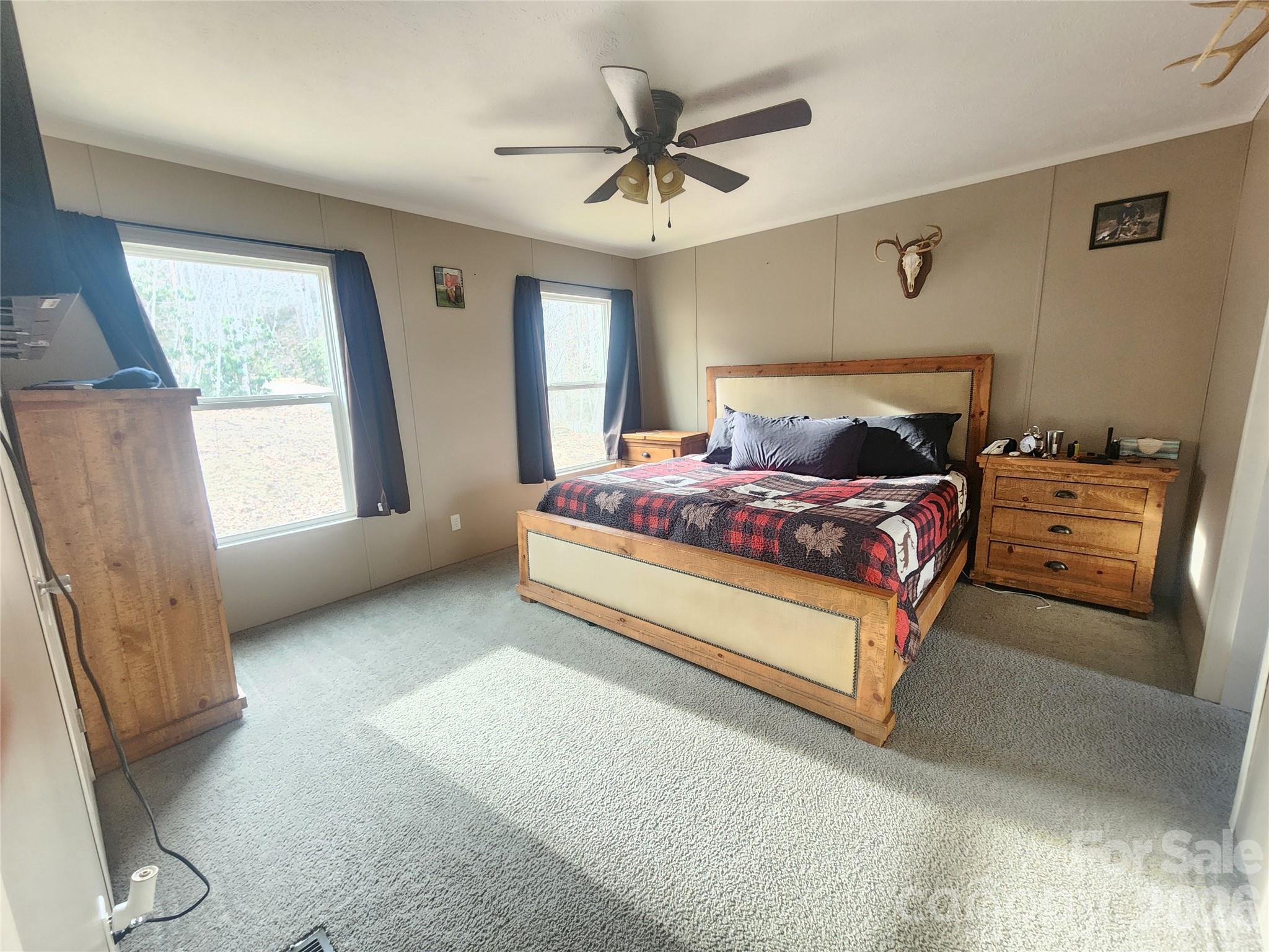 659 Cold Creek Road Canton, NC 28716 - Photo 15 of 37 a bedroom with a bed and window