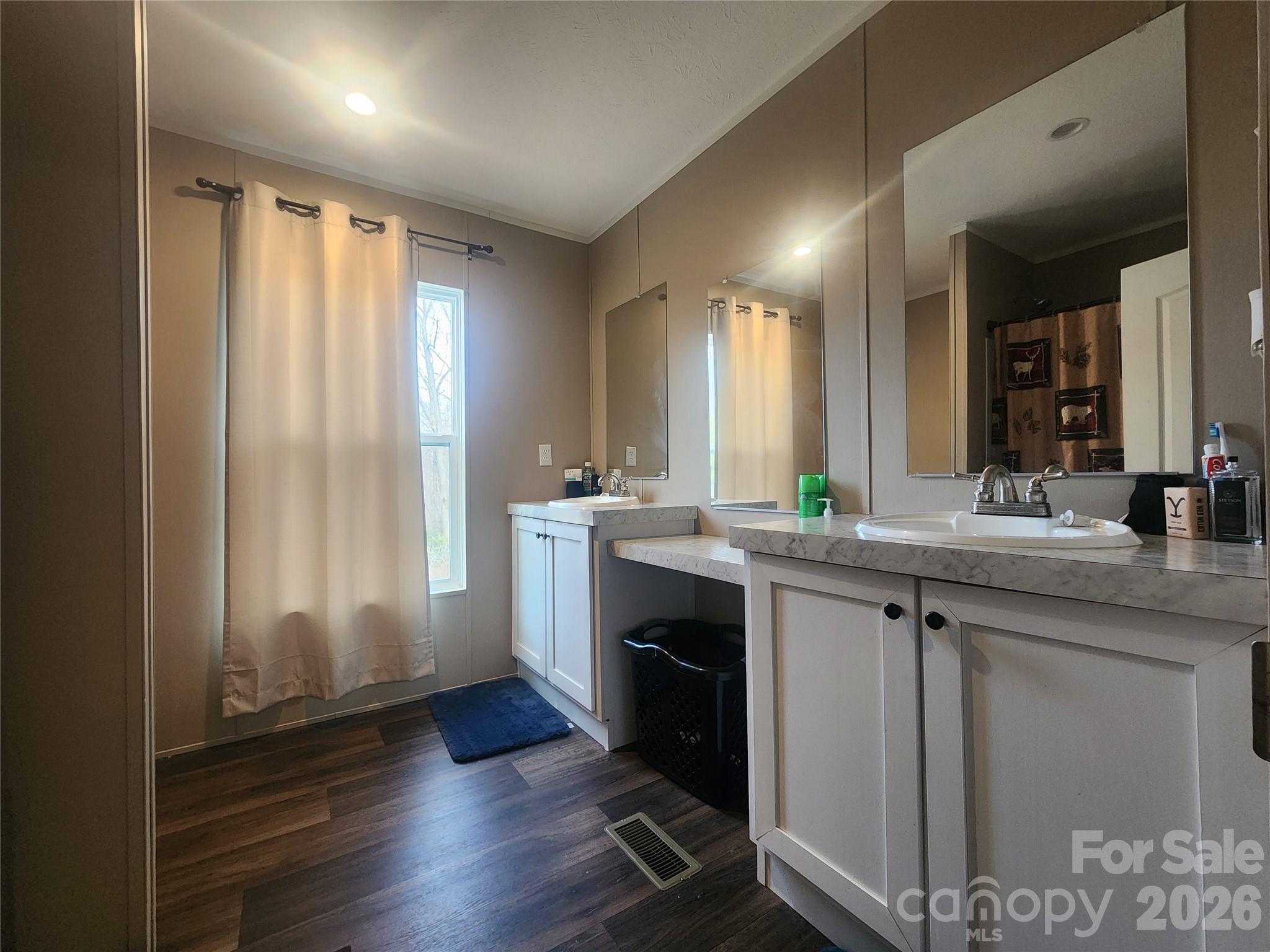 659 Cold Creek Road Canton, NC 28716 - Photo 23 of 37 a spacious bathroom with a double vanity sink a mirror and a shower