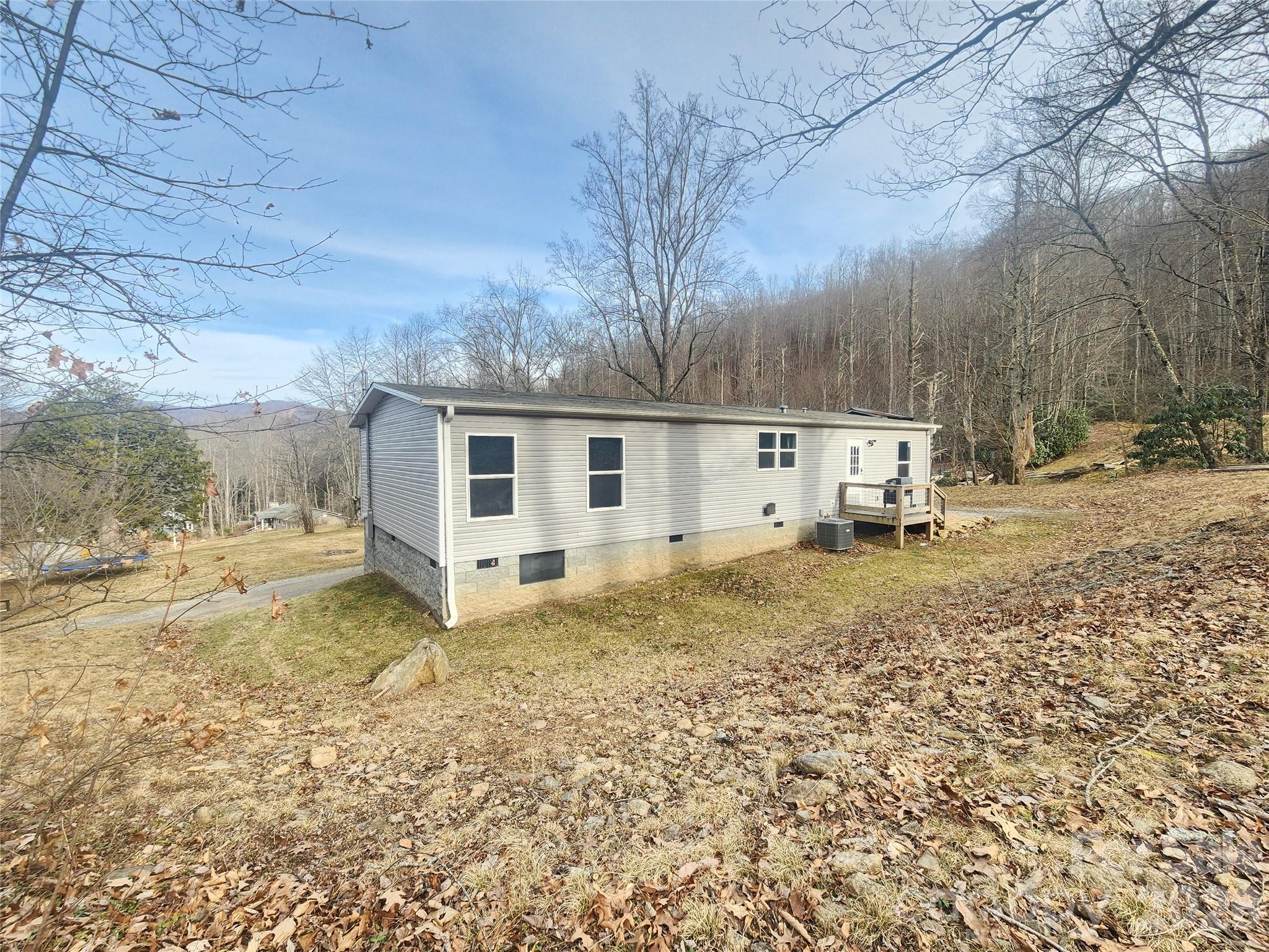 659 Cold Creek Road Canton, NC 28716 - Photo 6 of 37 a view of a house with a yard
