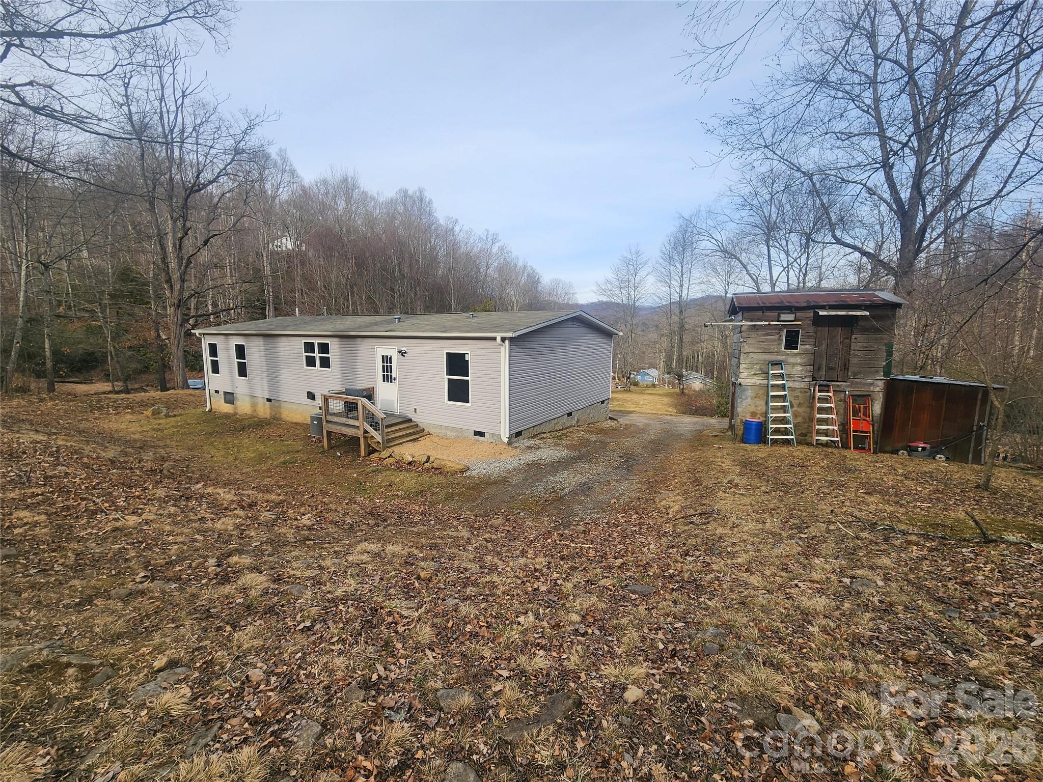 659 Cold Creek Road Canton, NC 28716 - Photo 7 of 37 a view of a house with a yard