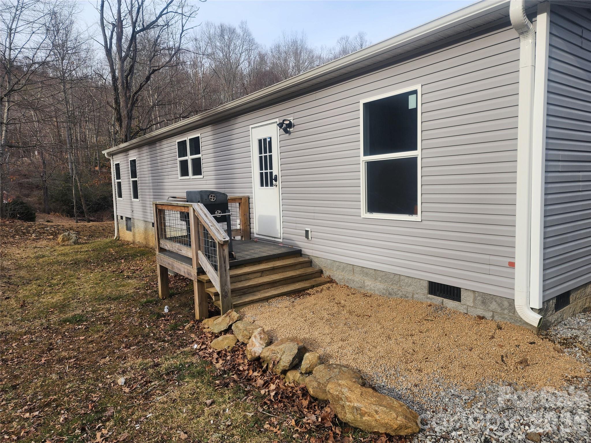 659 Cold Creek Road Canton, NC 28716 - Photo 8 of 37 a view of a house with backyard and sitting area
